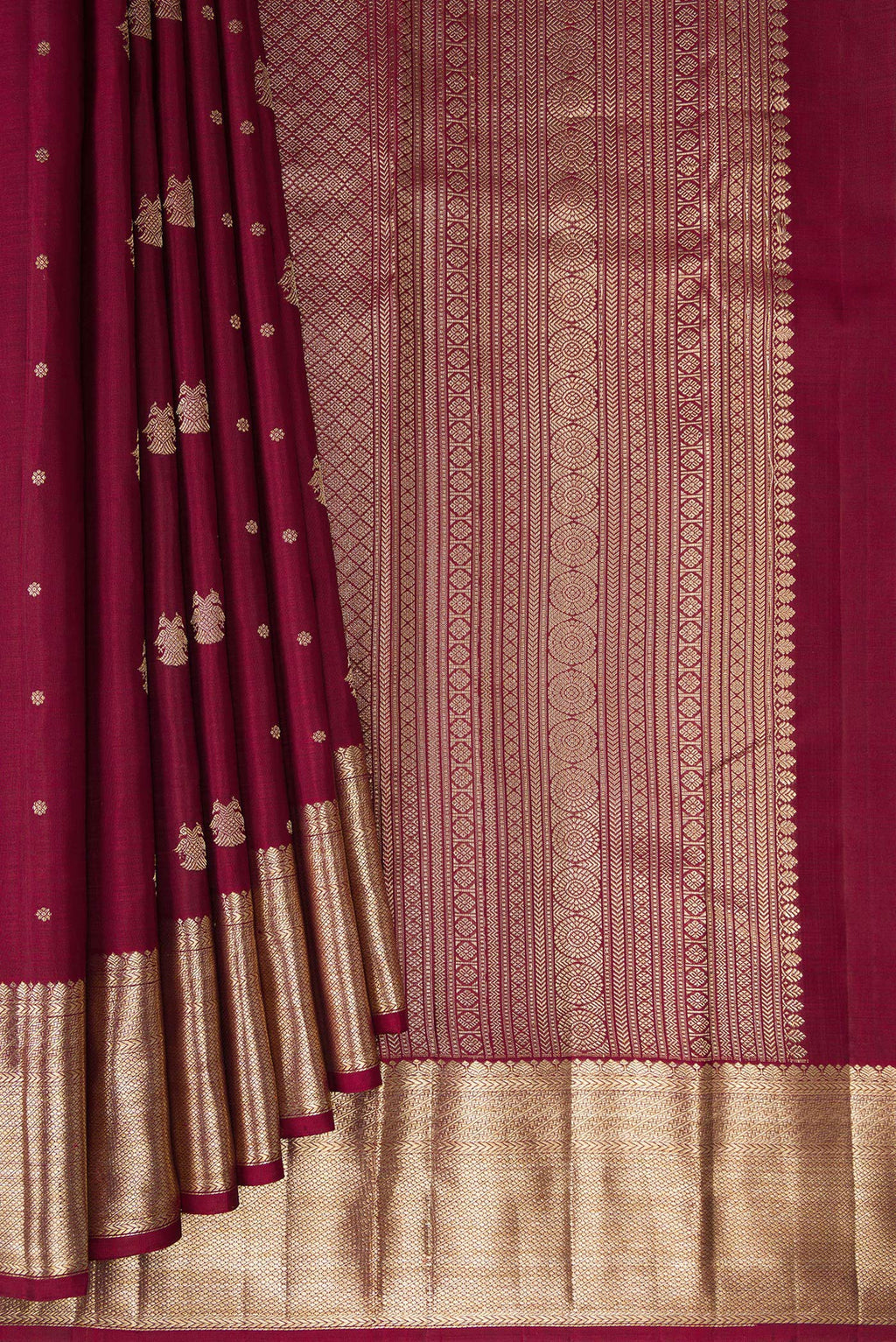 Pleats and pallu of Pure Silk Maroon Kanjivaram Saree with Zari Butta on the body and Zari Border. 