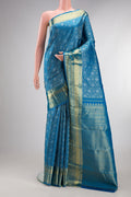 Pure Silk Peacock Blue Kanchipuram Saree with Zari Brocade on the body and Zari Border.  displayed on a mannequin