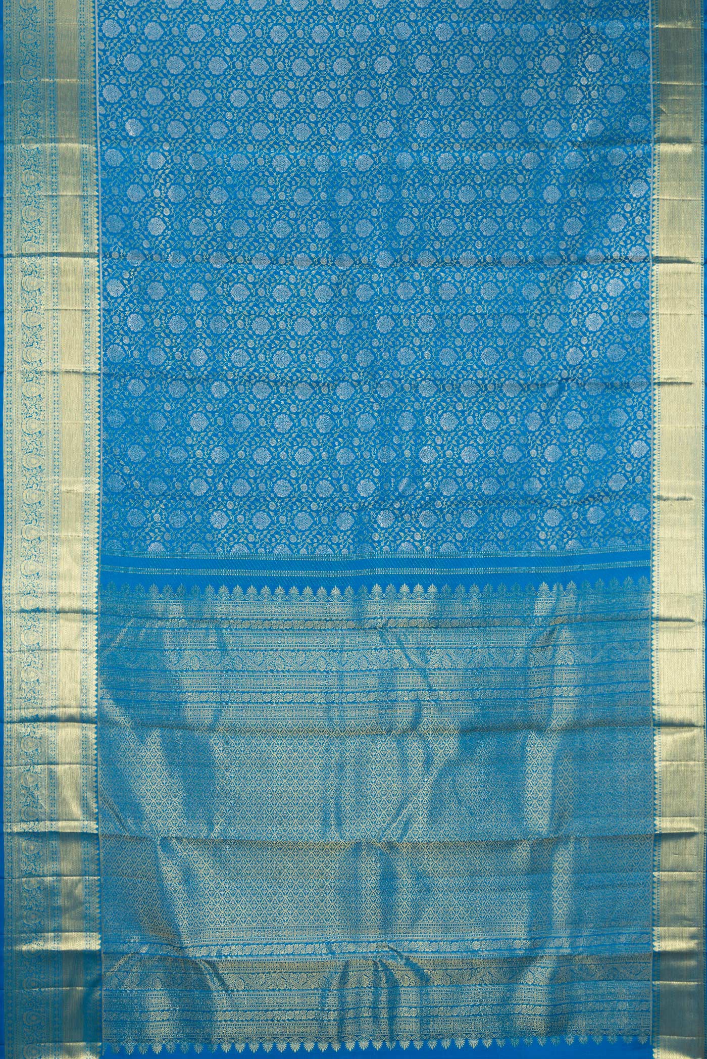 Flat view of Pure Silk Peacock Blue Kanchipuram Saree with Zari Brocade on the body and Zari Border. 