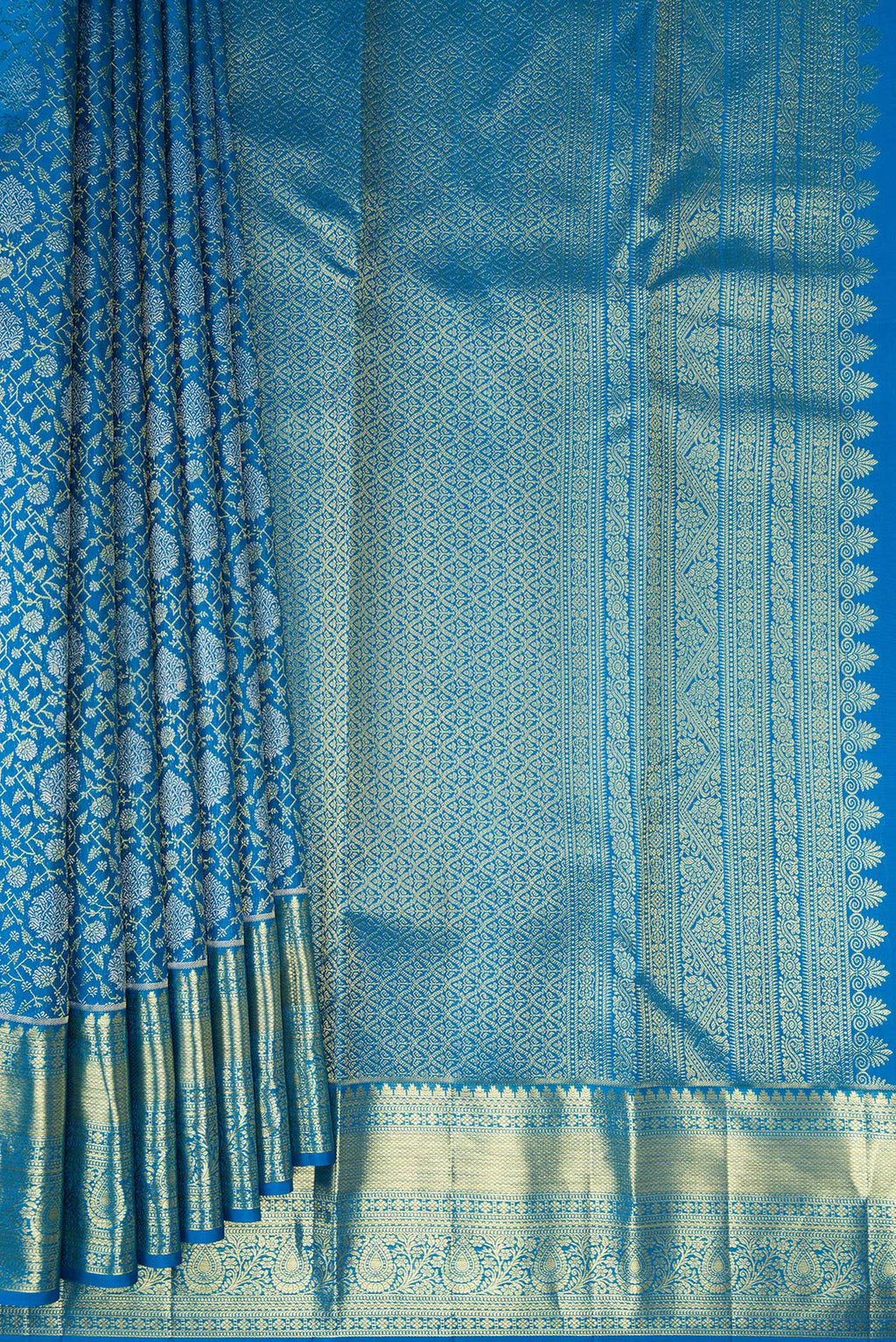 Pleats and pallu of Pure Silk Peacock Blue Kanchipuram Saree with Zari Brocade on the body and Zari Border. 