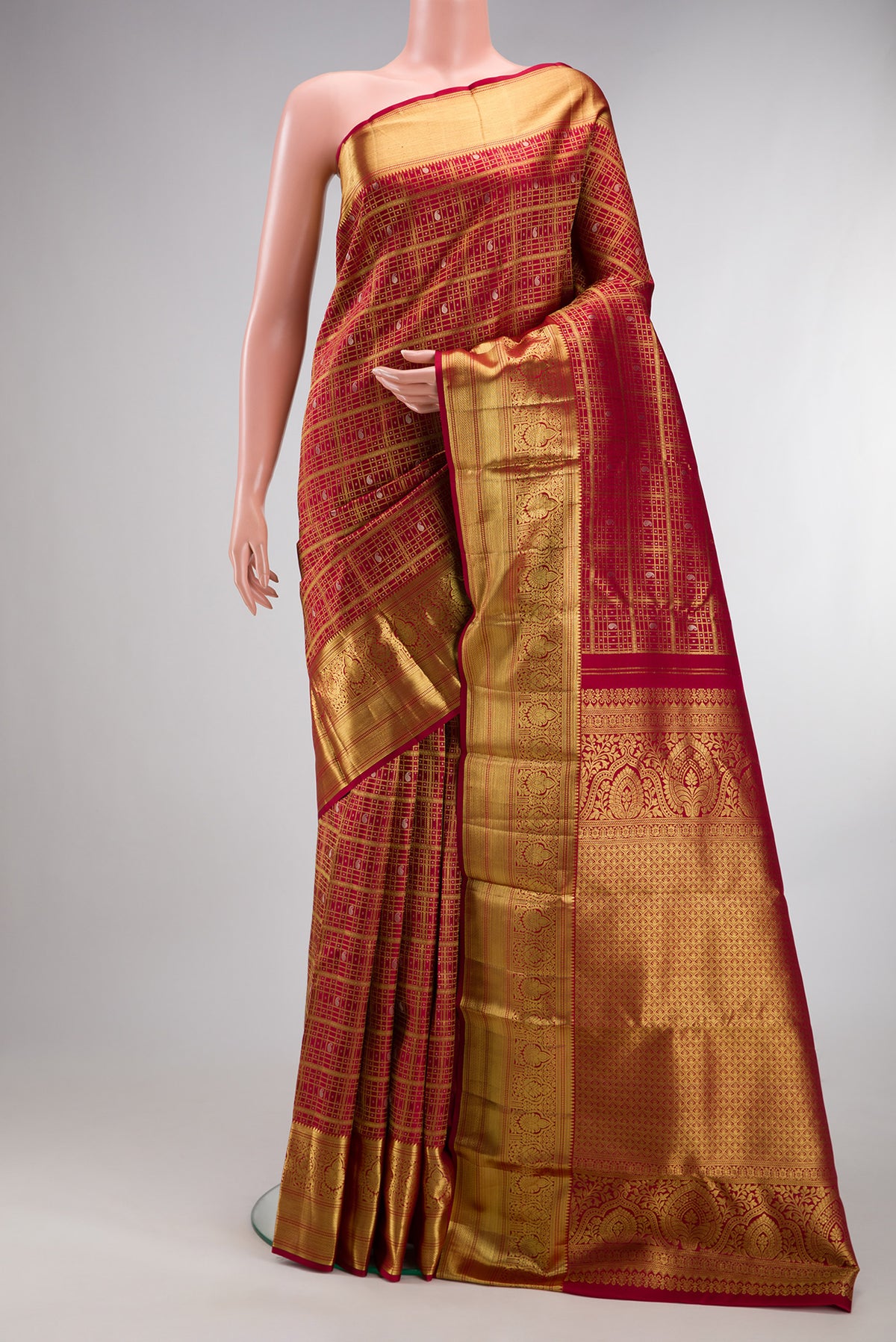 Pure Silk Deep Red Dual Tone Kanchipuram Saree with Checked design on the body and Zari Border.  displayed on a mannequin