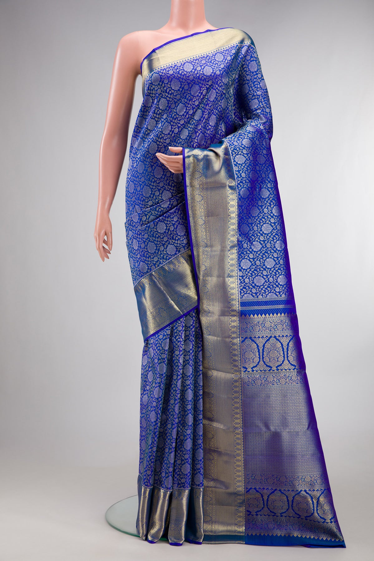 Pure Silk Royal Blue Kanchipuram Saree with Zari Brocade on the body and Zari Border.  displayed on a mannequin