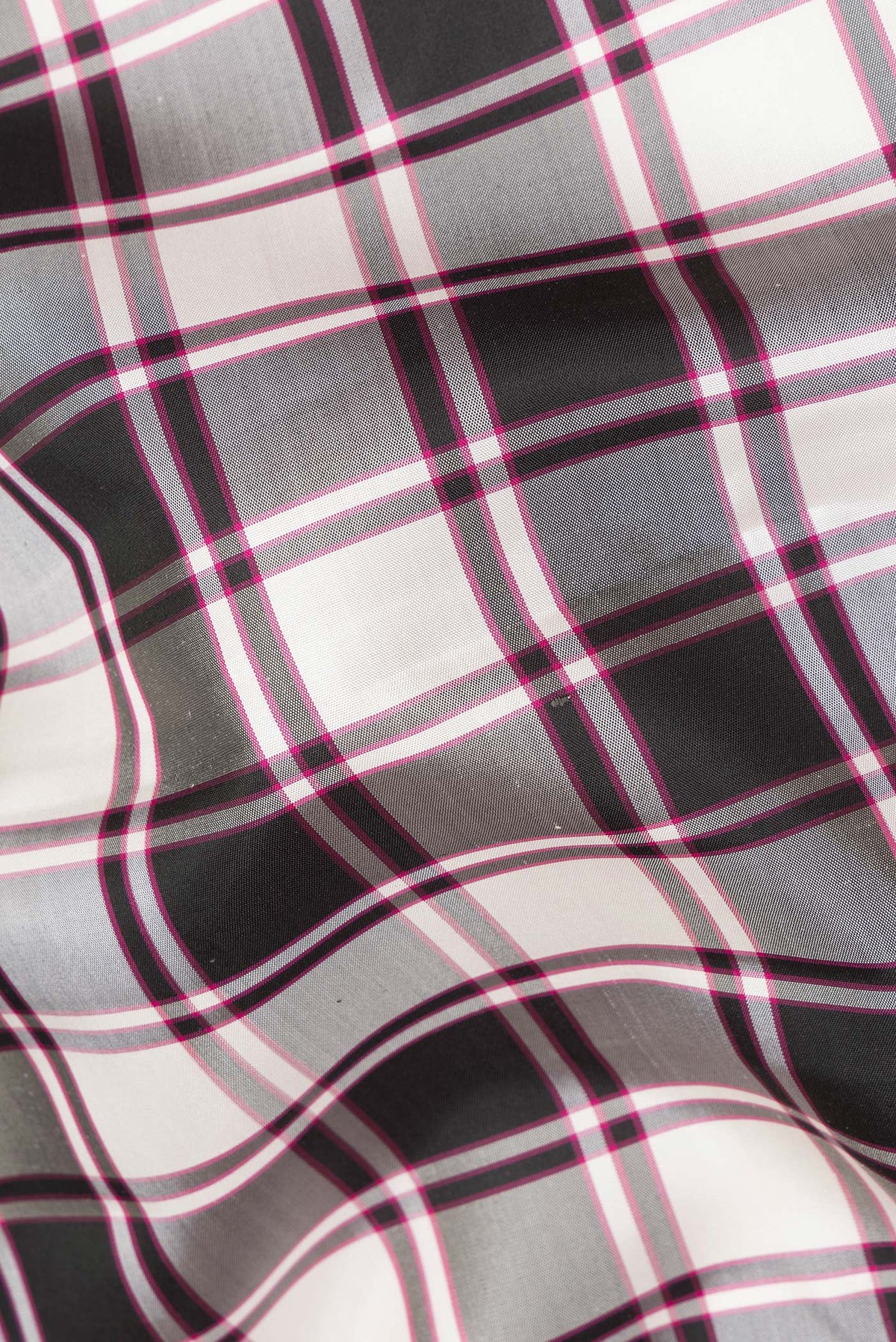 Close up of Pure Silk Multi Color Kanchipuram Saree with Checked design on the body and Zari Border.  displaying folds