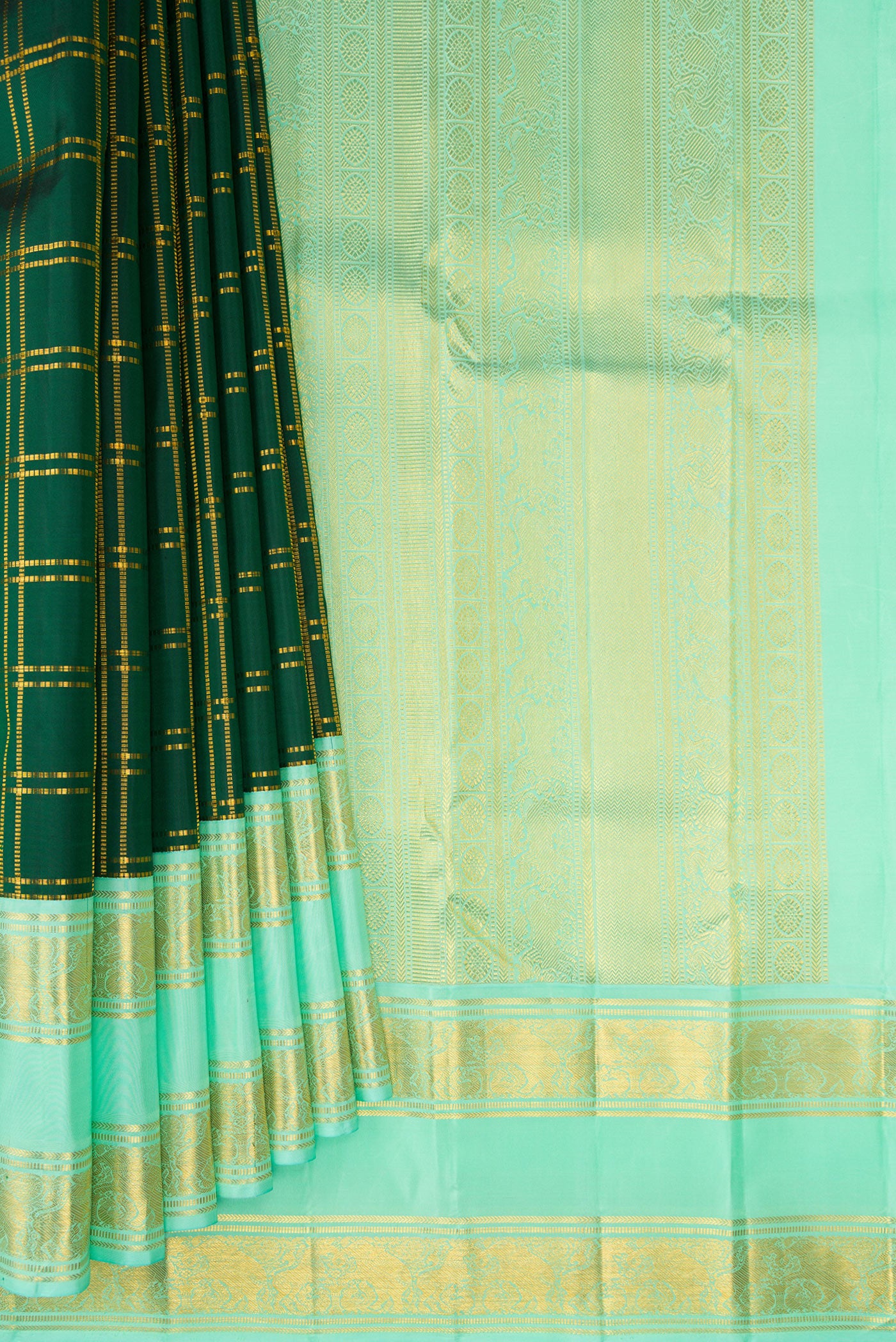 Pleats and pallu of Pure Silk Bottle Green Kanjivaram Saree with Checked design on the body and Zari Border. 