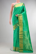 Pure Silk Sea Green Kanjivaram Saree with Checked design on the body and Zari Border.  displayed on a mannequin
