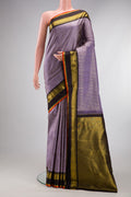 Pure Silk Lavender Kanjivaram Saree with Stripes on the body and Zari Border.  displayed on a mannequin