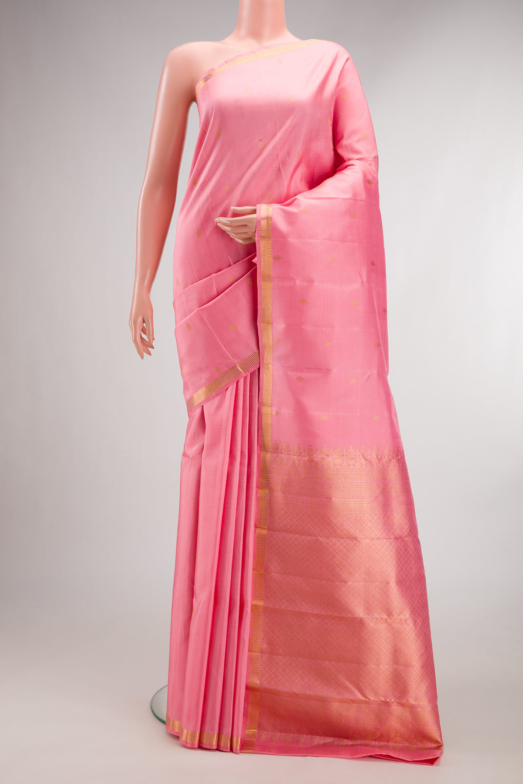 Pure Silk Rose pink Kanjivaram Saree with Zari Butta on the body and Zari Border.  displayed on a mannequin
