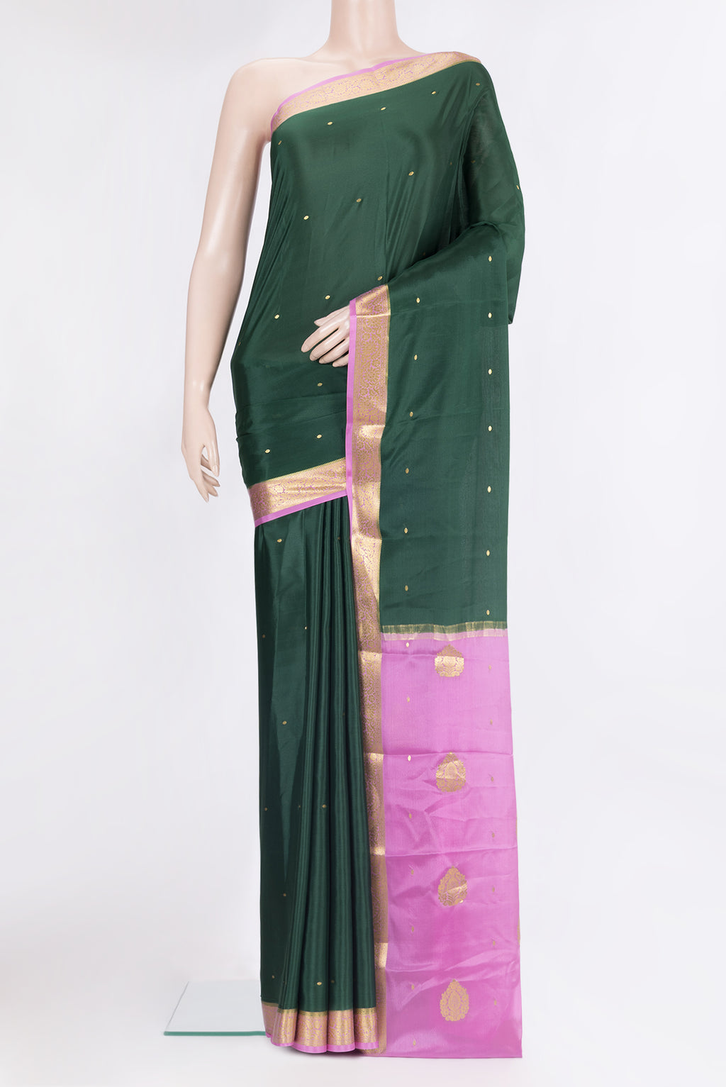 Pure Silk Bottle Green Mysore Silk Saree with Zari Butta on the body and Zari Border.  displayed on a mannequin