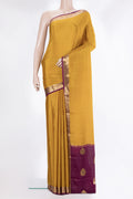 Mustard Mysore Crepe Saree with Zari Butta on the body and Zari Border.  displayed on a mannequin