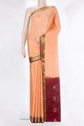 Peach Mysore Crepe Saree with Zari Butta on the body and Zari Border.  displayed on a mannequin