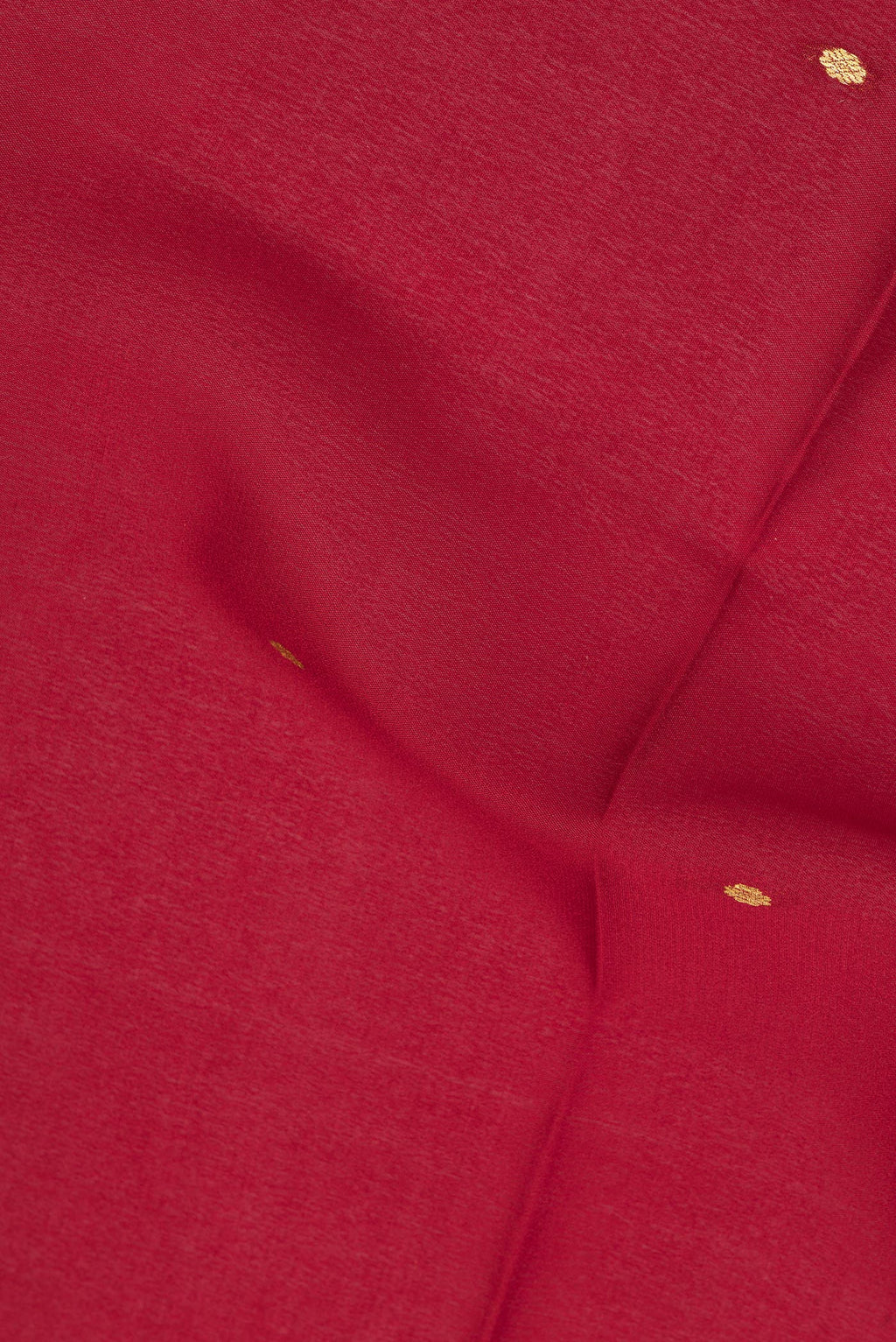 Close up of Red Mysore Crepe Saree with Zari Butta on the body and Zari Border.  displaying folds