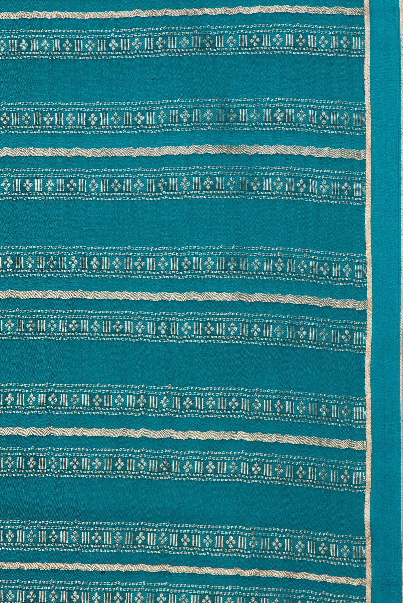 Border image of Peacock Blue Dual Tone Banarasi Georgette Saree with Zari Brocade on the body and Plain Border. 