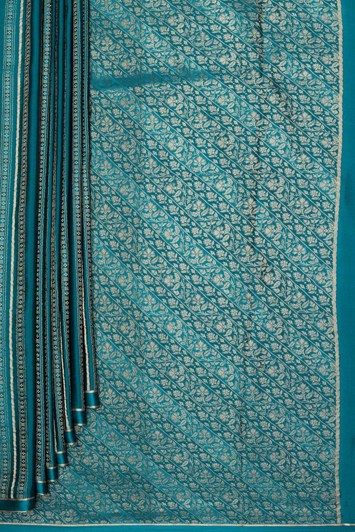 Pleats and pallu of Peacock Blue Dual Tone Banarasi Georgette Saree with Zari Brocade on the body and Plain Border. 