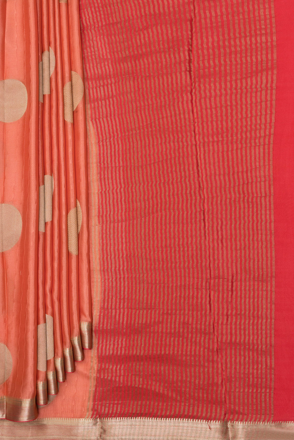 Pleats and pallu of Peach Mysore Crepe Saree with Zari Butta on the body and Zari Border. 