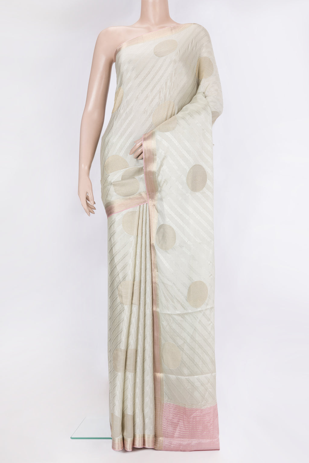 Beige Mysore Chiffon Saree with Zari Butta on the body and Zari Border.  displayed on a mannequin