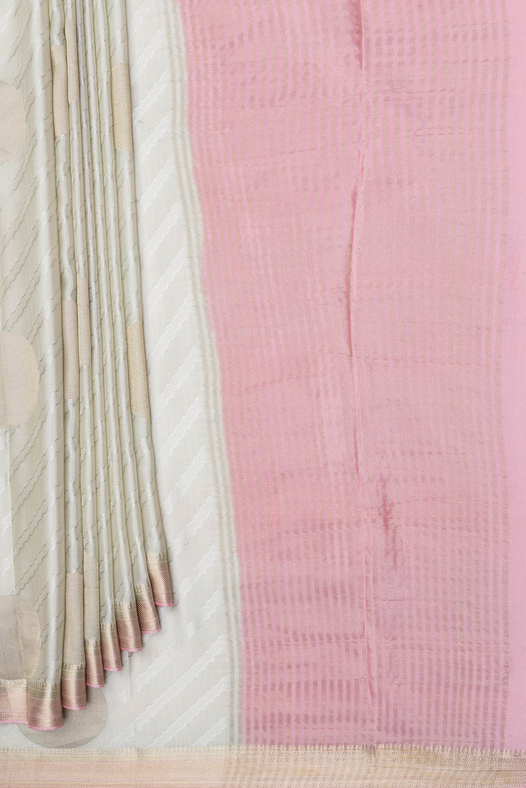 Pleats and pallu of Beige Mysore Chiffon Saree with Zari Butta on the body and Zari Border. 