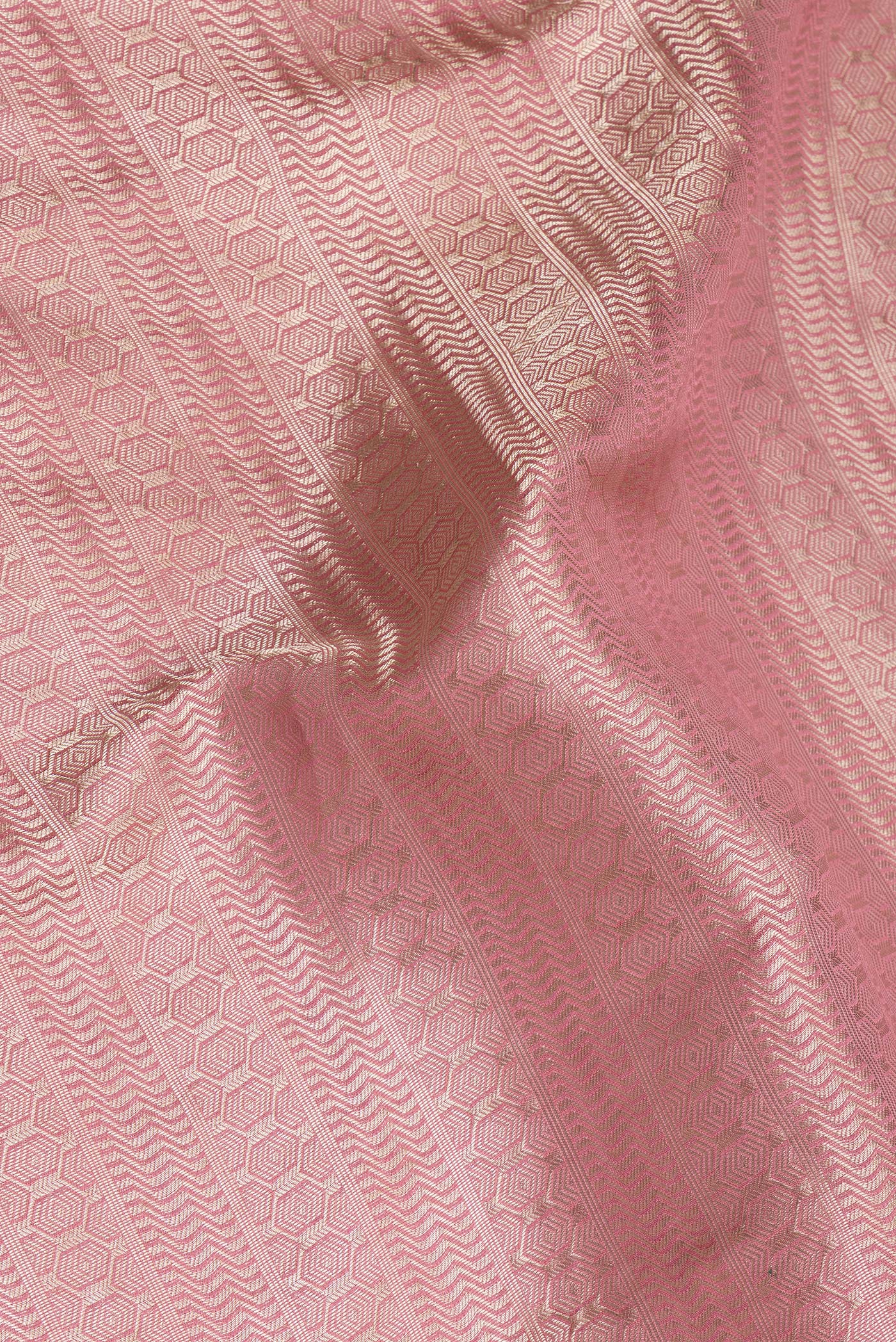 Close up of Pink Dual Tone Banarasi Georgette Saree with Zari Brocade on the body and Zari Border.  displaying folds