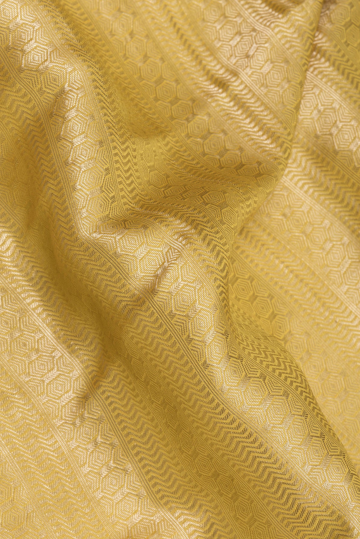 Close up of Pure Silk Mehandi Green Dual Tone Banarasi Georgette Saree with Zari Brocade on the body and Zari Border.  displaying folds
