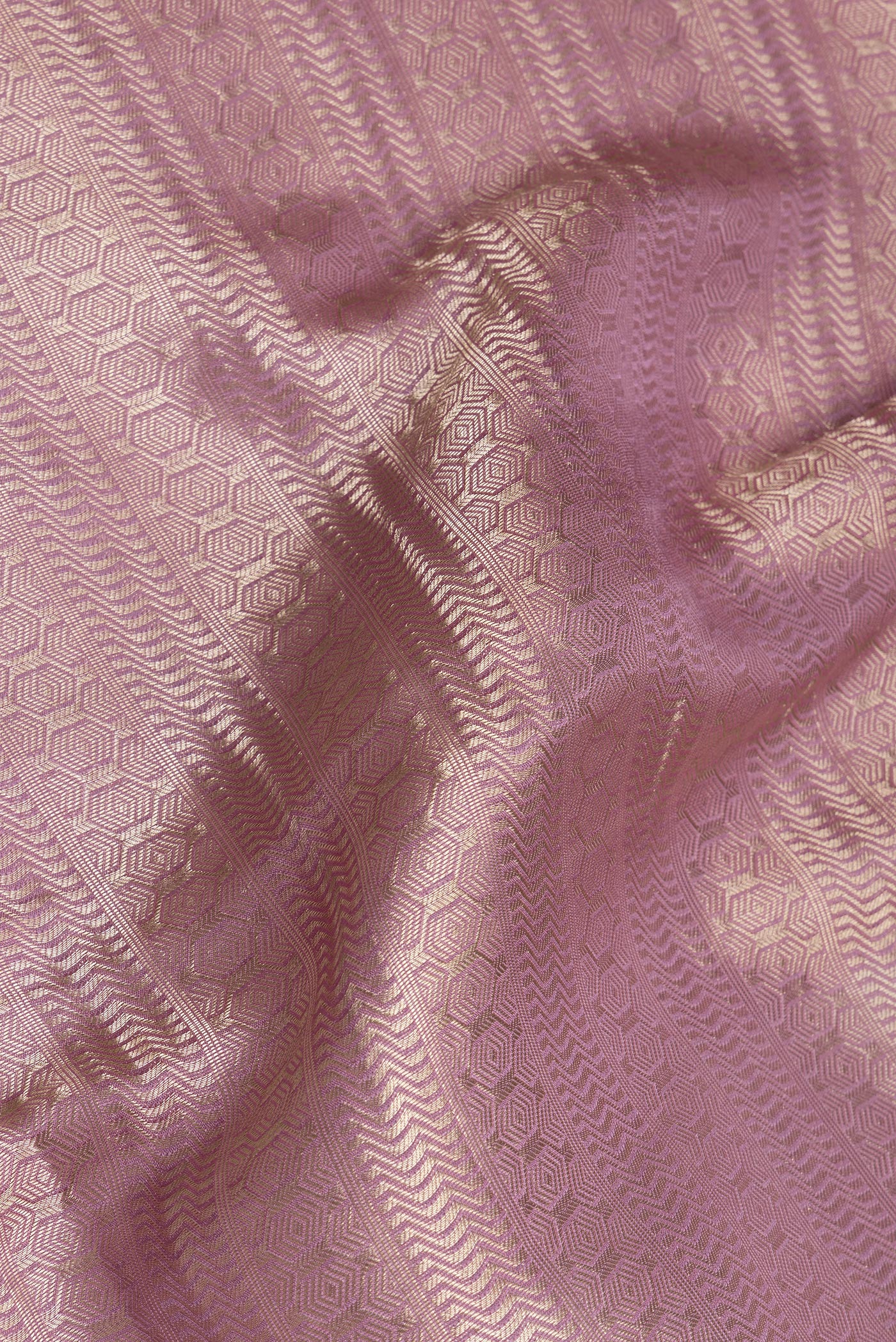 Close up of Lavender Dual Tone Banarasi Georgette Saree with Zari Brocade on the body and Zari Border.  displaying folds