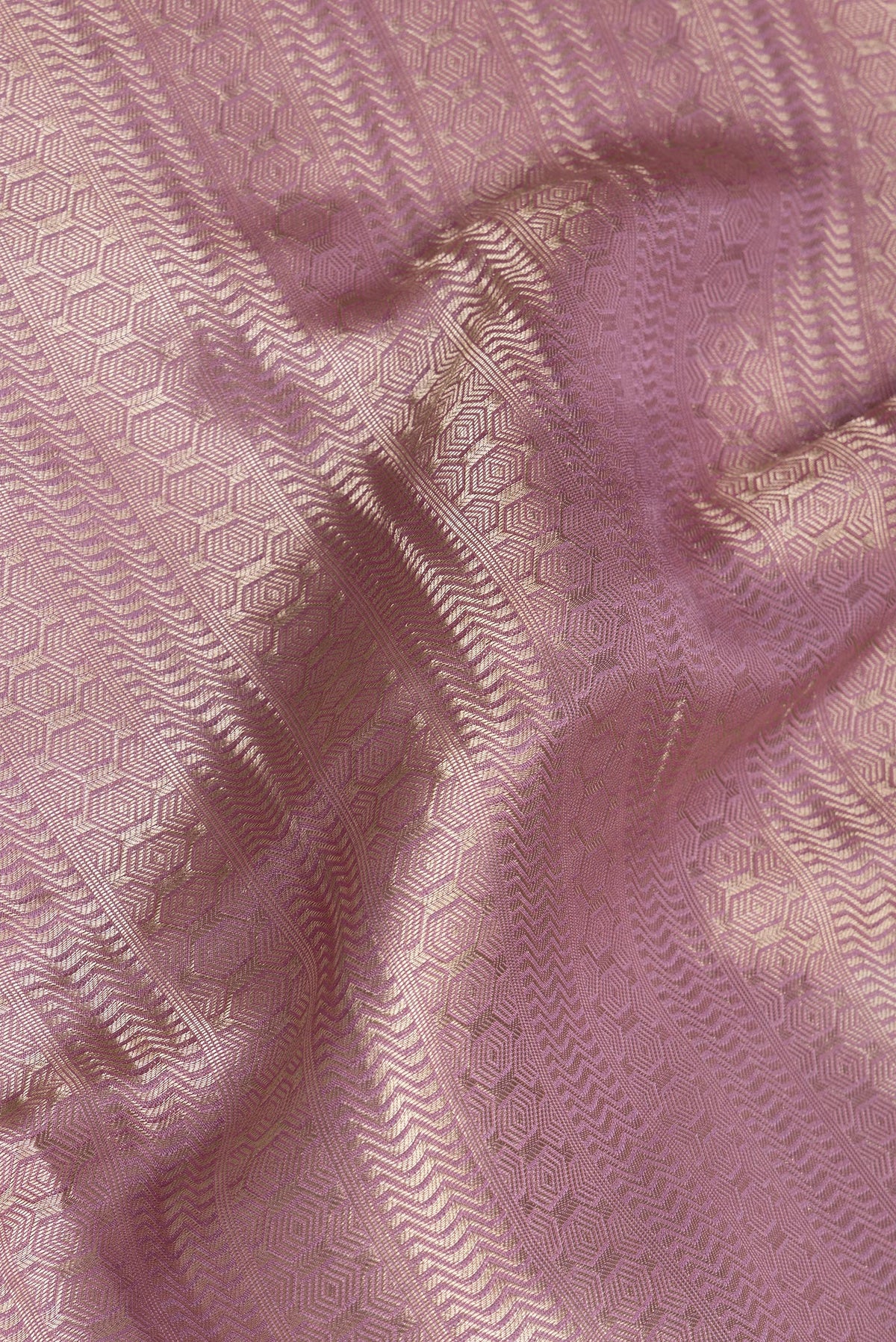 Close up of Lavender Dual Tone Banarasi Georgette Saree with Zari Brocade on the body and Zari Border.  displaying folds