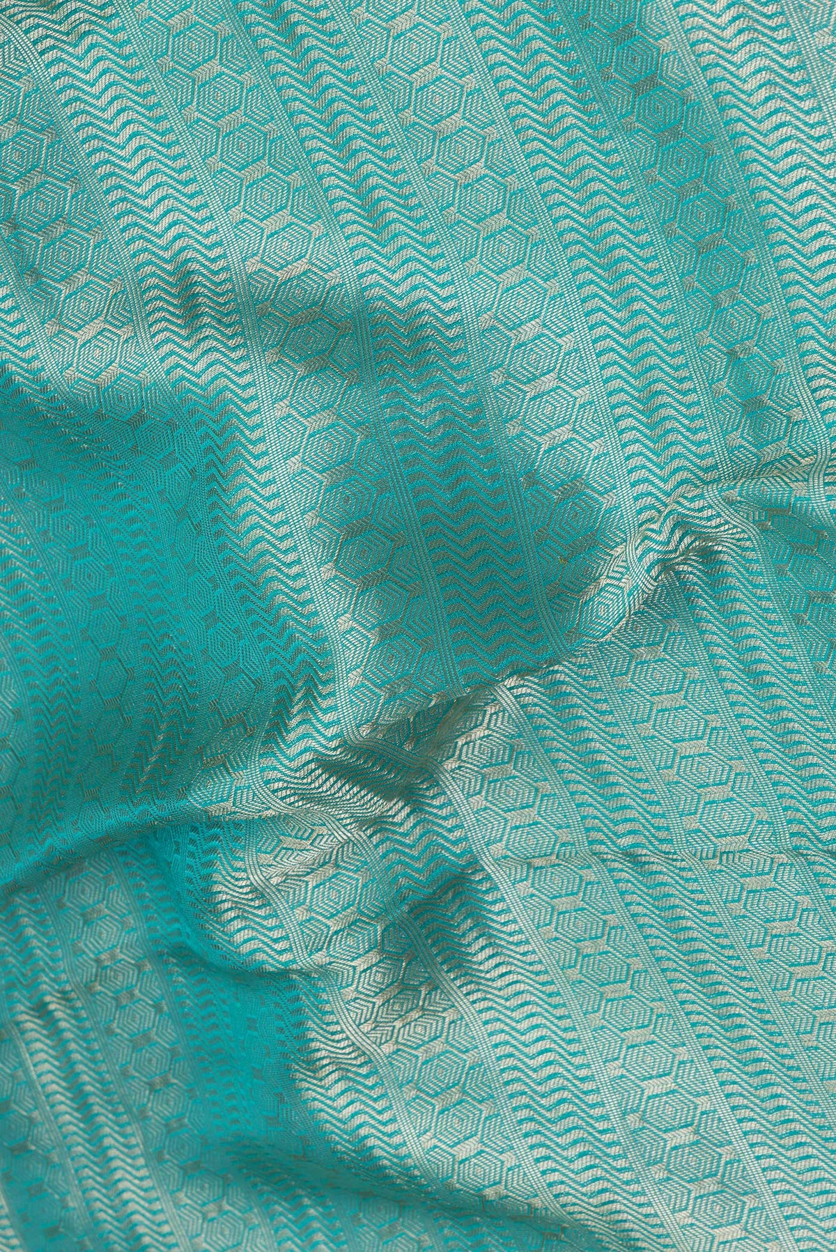 Close up of Sky Blue Dual Tone Banarasi Georgette Saree with Stripes on the body and Zari Border.  displaying folds