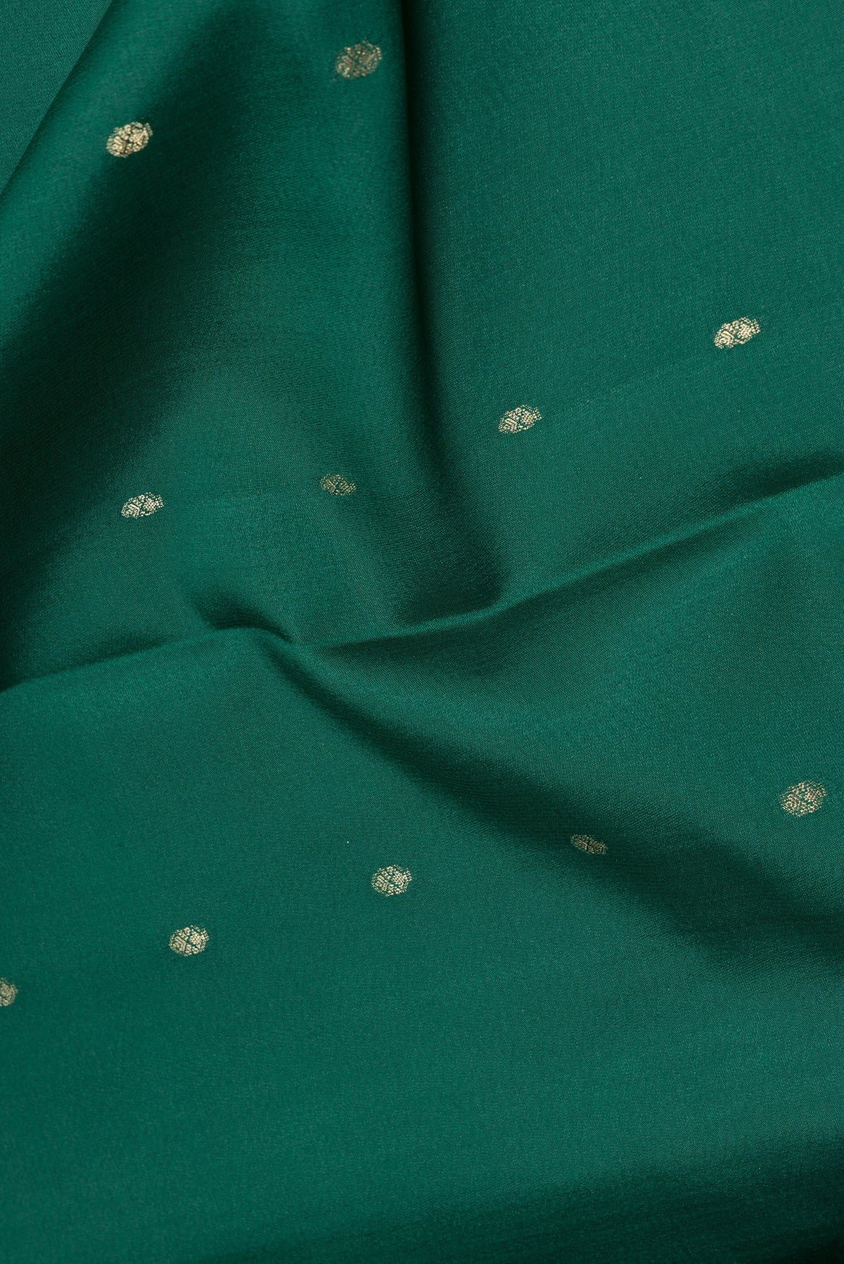 Close up of Pure Silk Green Dual Tone Banarasi Georgette Saree with Zari Butta on the body and Zari Border.  displaying folds