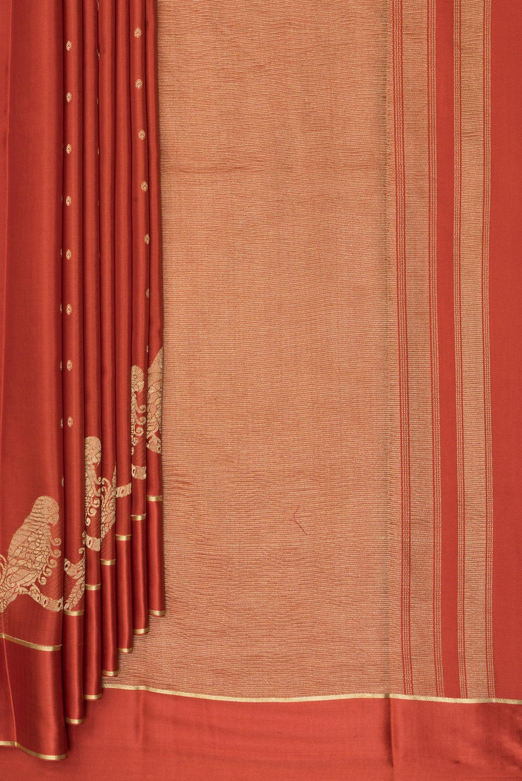 Pleats and pallu of Brick Orange Dual Tone Georgette Saree with Zari Butta on the body and Zari Border. 