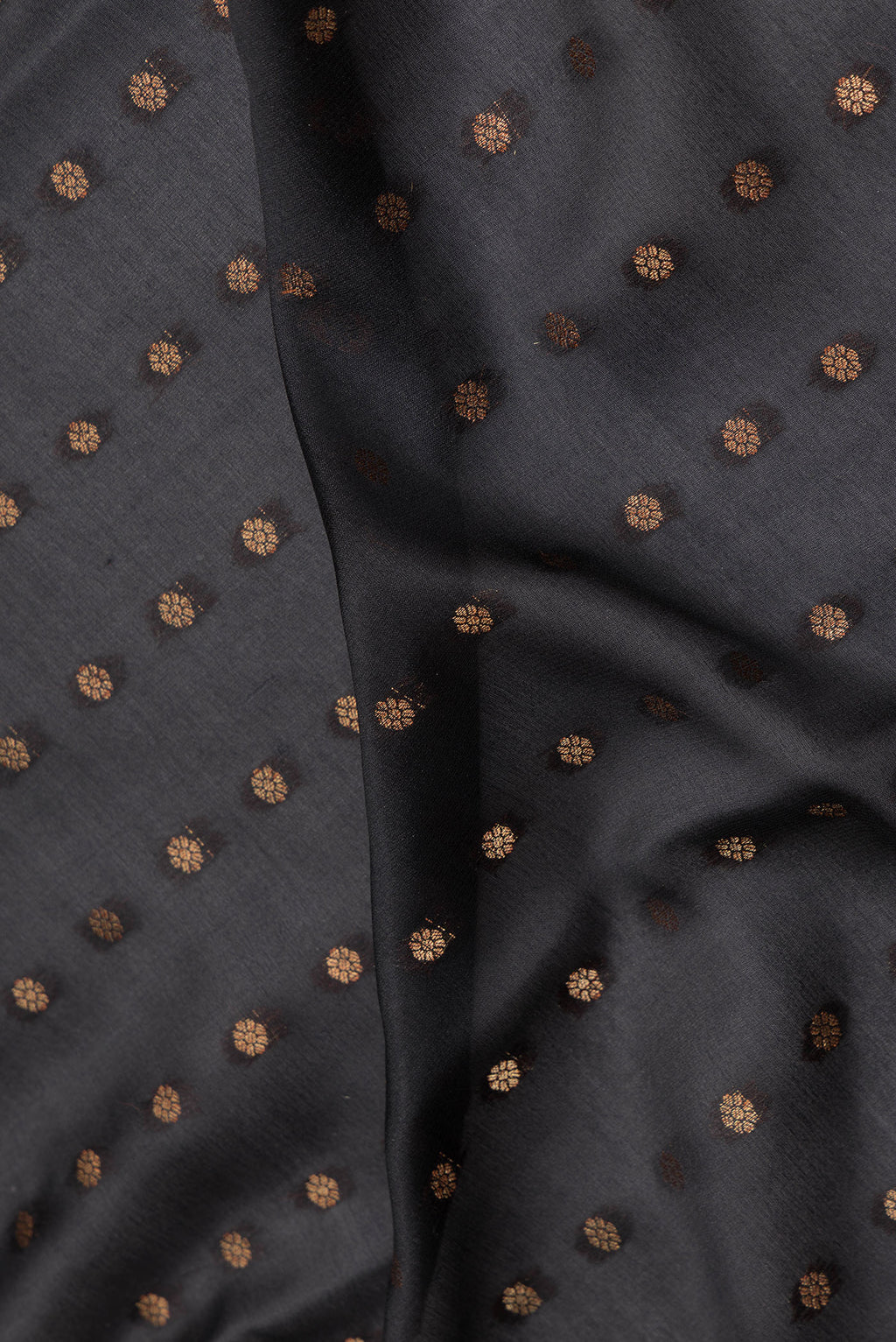 Close up of Pure Silk Black Dual Tone Banarasi Georgette Saree with Zari Butta on the body and Fancy Border.  displaying folds