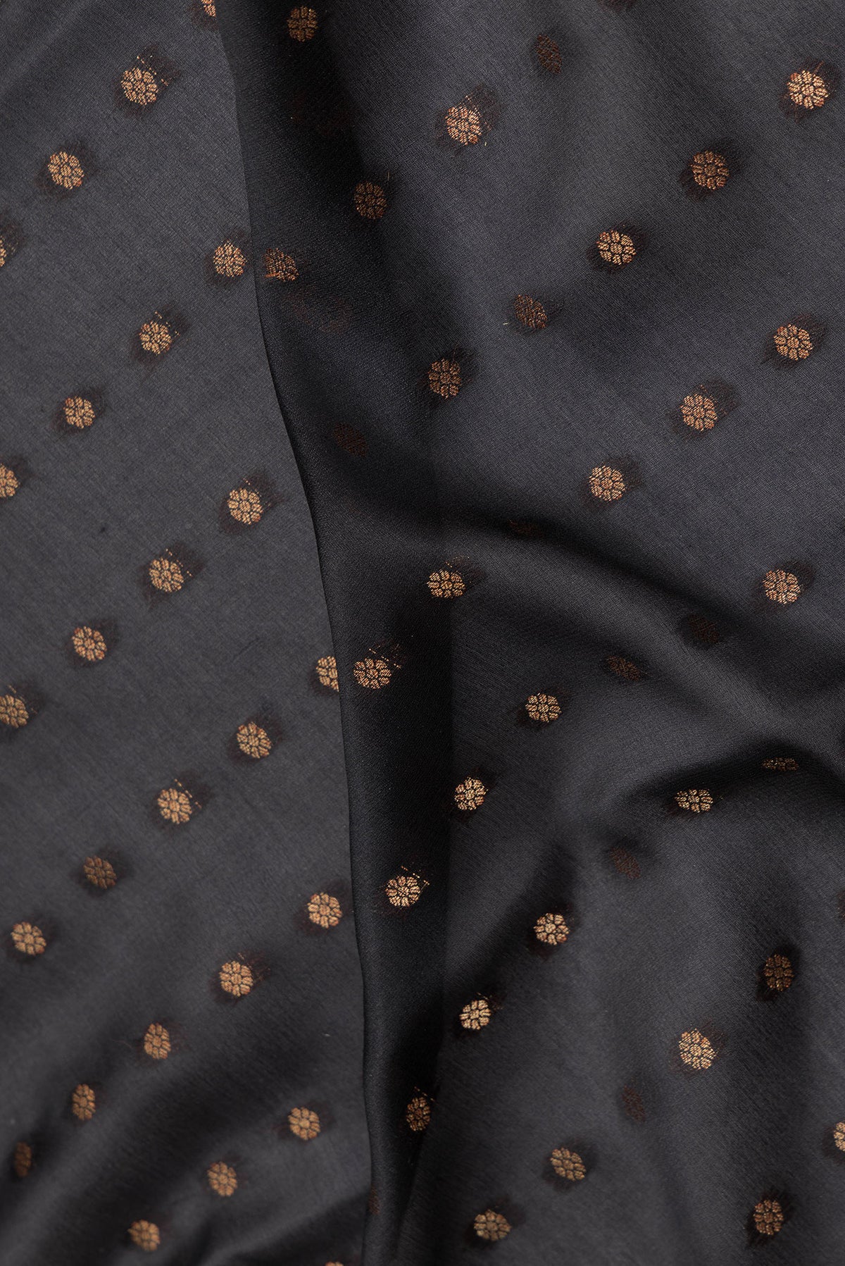 Close up of Pure Silk Black Dual Tone Banarasi Georgette Saree with Zari Butta on the body and Fancy Border.  displaying folds