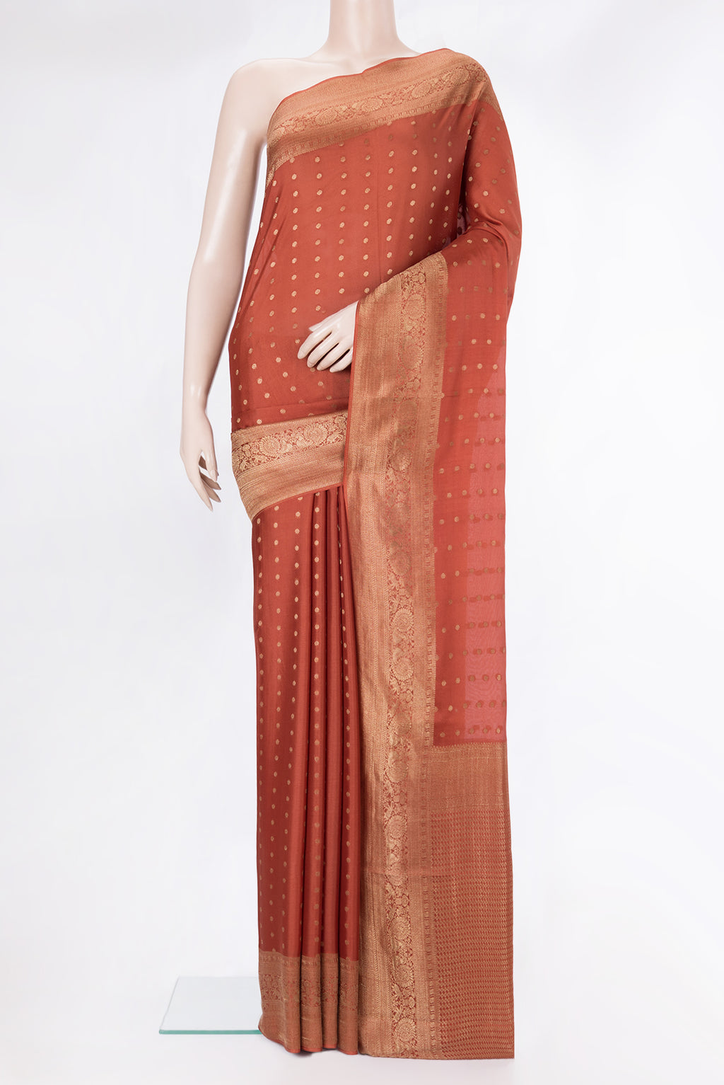 Rust Dual Tone Georgette Saree with Zari Butta on the body and Zari Border.  displayed on a mannequin
