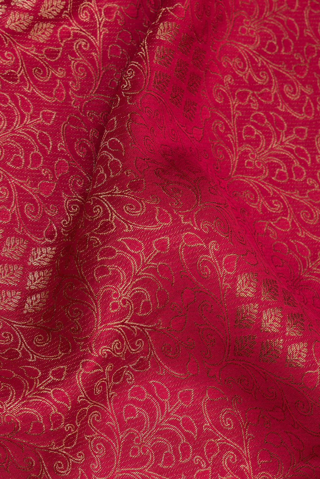 Close up of Dark Pink Georgette Saree with Zari Brocade on the body and Zari Border.  displaying folds