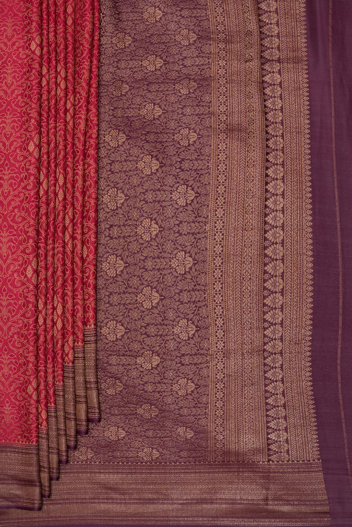 Pleats and pallu of Dark Pink Georgette Saree with Zari Brocade on the body and Zari Border. 