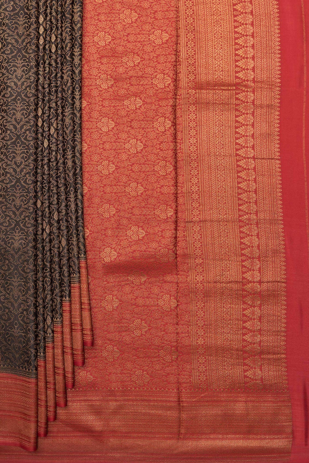 Pleats and pallu of Pure Silk Black Dual Tone Banarasi Georgette Saree with Zari Brocade on the body and Zari Border. 