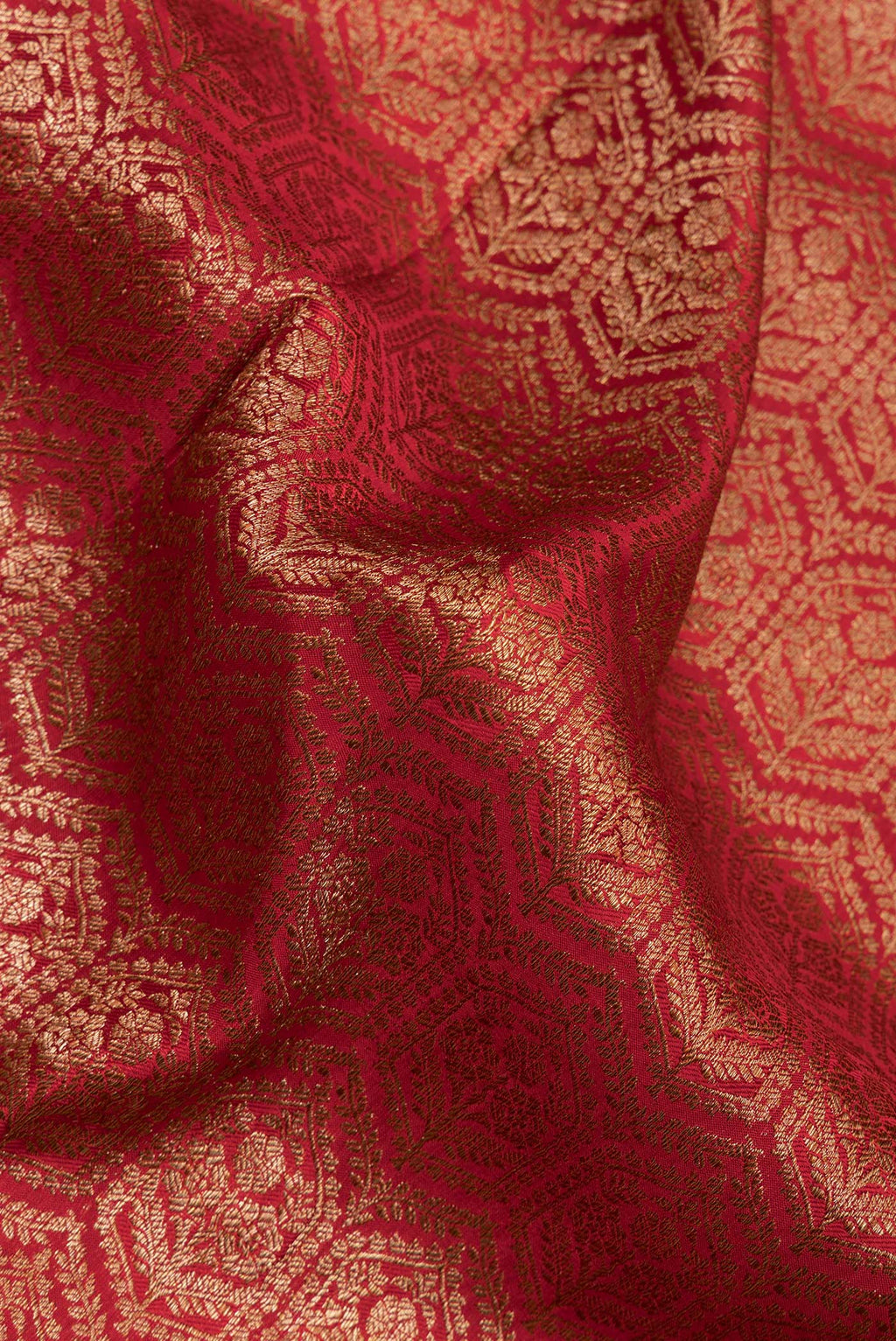 Close up of Red Dual Tone Mysore Crepe Saree with Zari Brocade on the body and Zari Border.  displaying folds