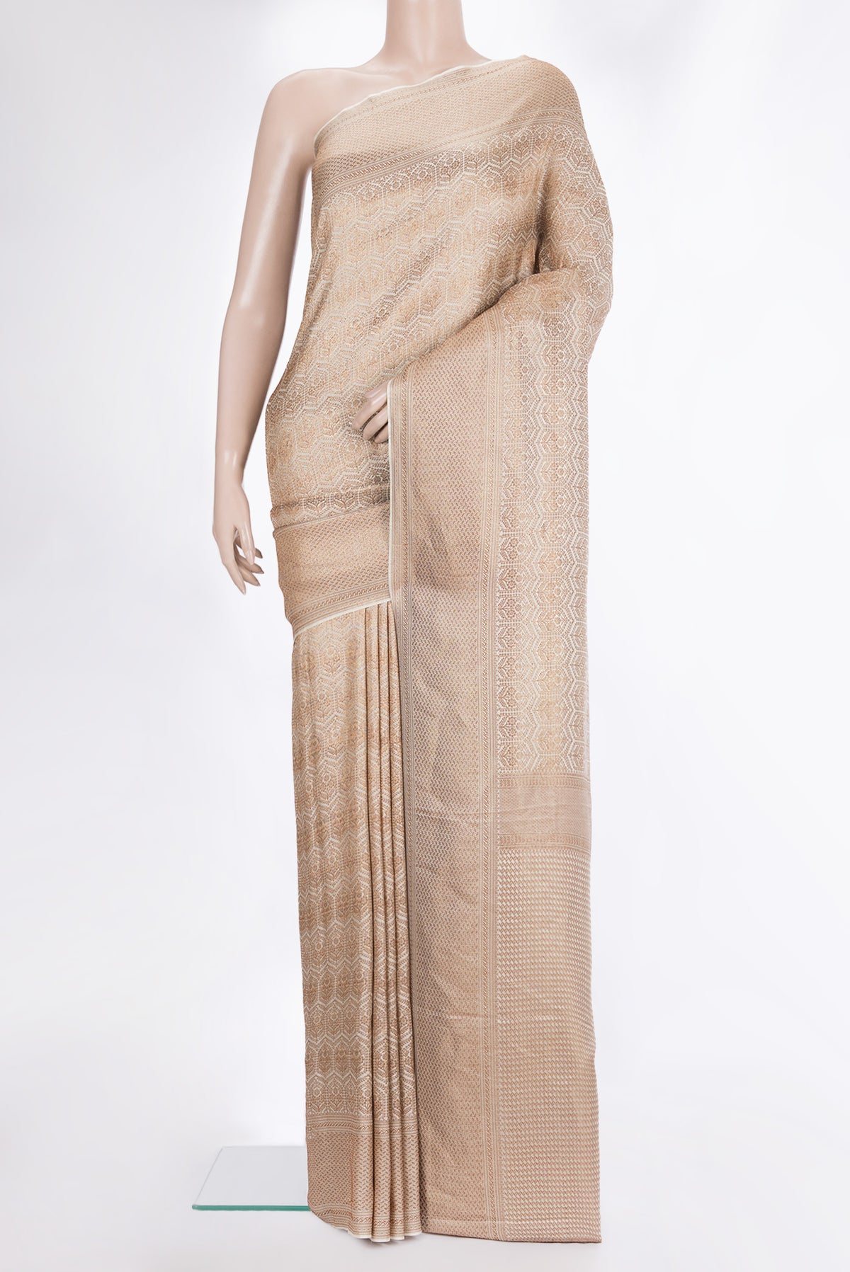 Off White Crepe Saree with Zari Brocade on the body and Zari Border.  displayed on a mannequin