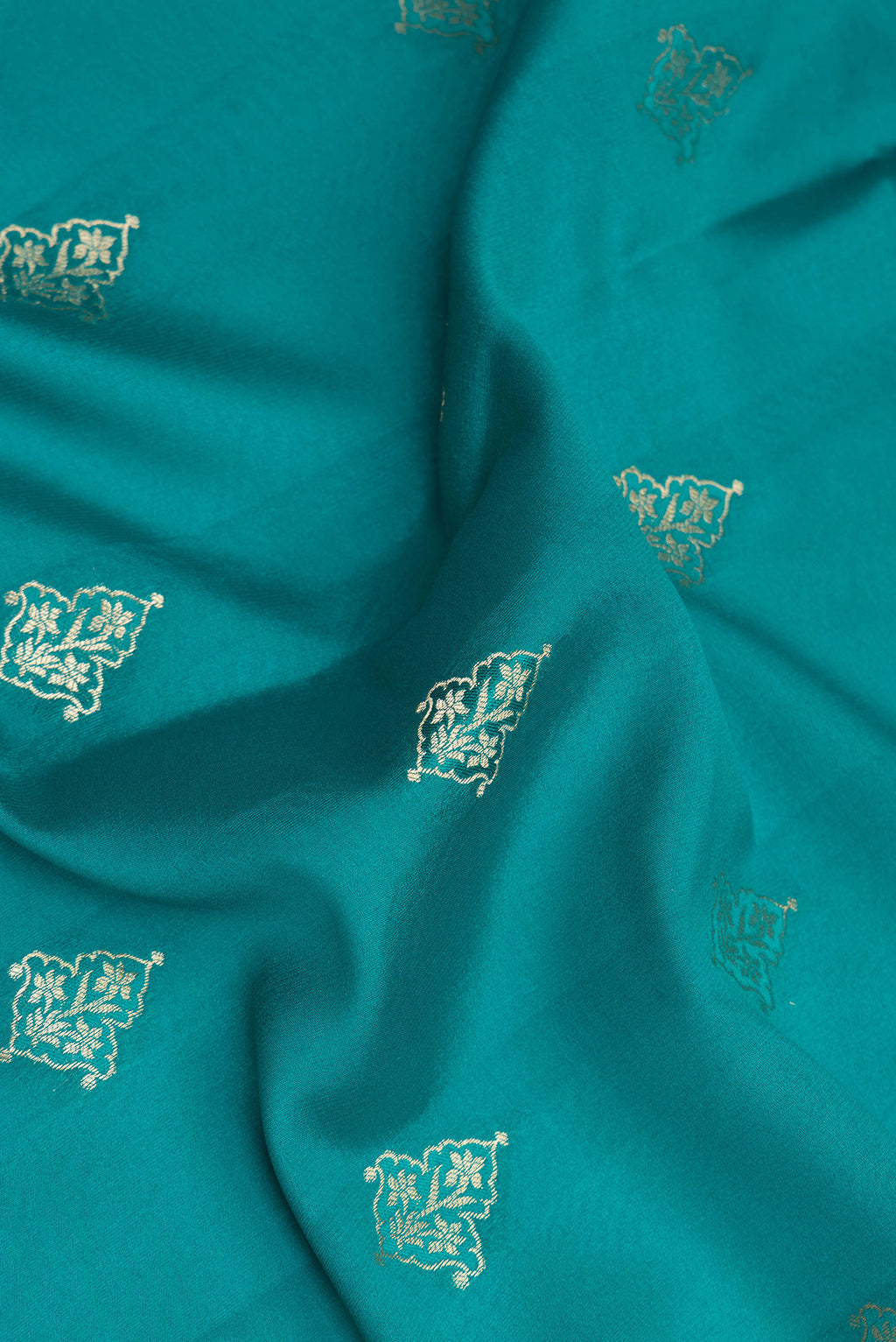 Close up of Pure Silk Sky Blue Dual Tone Banarasi Georgette Saree with Zari Butta on the body and Zari Border.  displaying folds