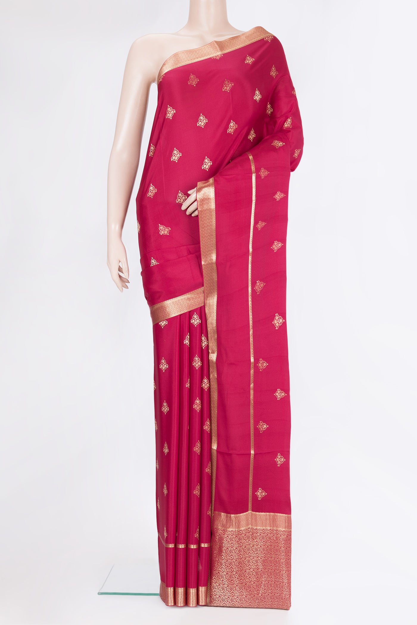 Dark Pink Georgette Saree with Zari Butta on the body and Zari Border.  displayed on a mannequin
