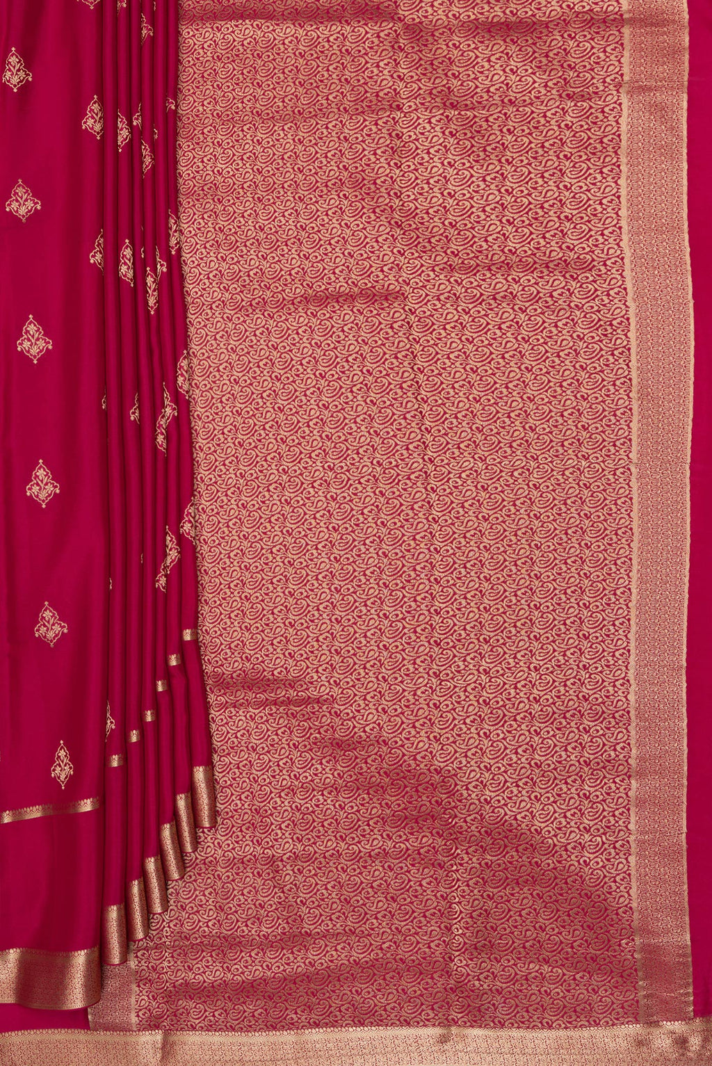 Pleats and pallu of Dark Pink Georgette Saree with Zari Butta on the body and Zari Border. 