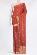 Pure Silk Rust Dual Tone Banarasi Georgette Saree with Zari Butta on the body and Zari Border.  displayed on a mannequin