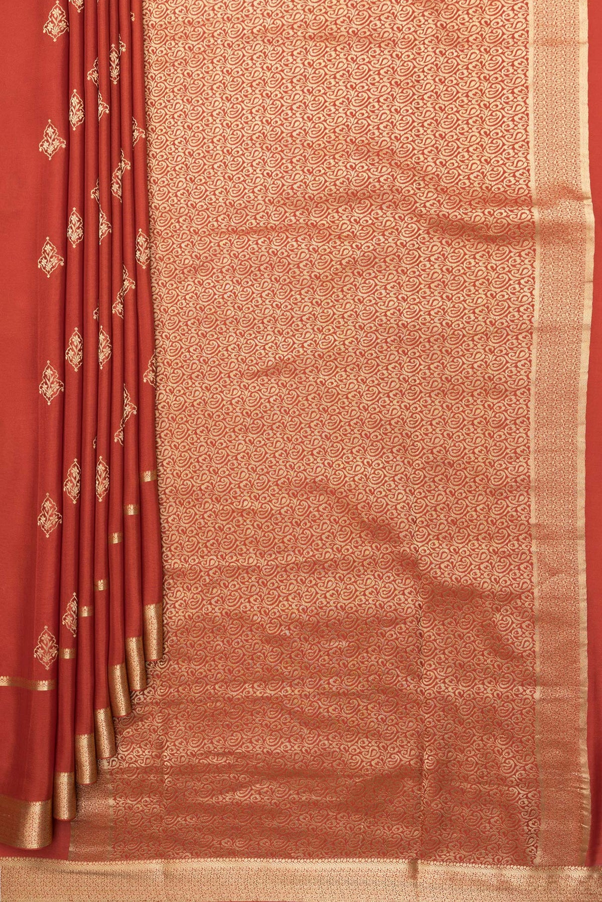 Pleats and pallu of Pure Silk Rust Dual Tone Banarasi Georgette Saree with Zari Butta on the body and Zari Border. 