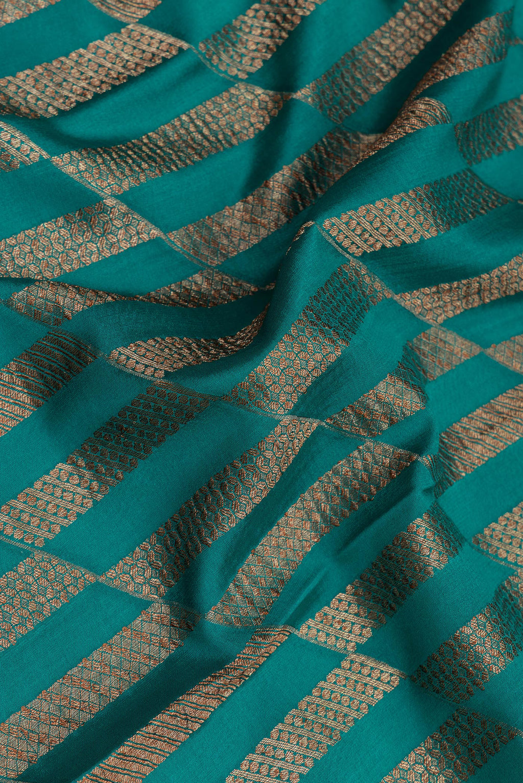 Close up of Blue Dual Tone Banarasi Georgette Saree with Zari Brocade on the body and Zari Border.  displaying folds