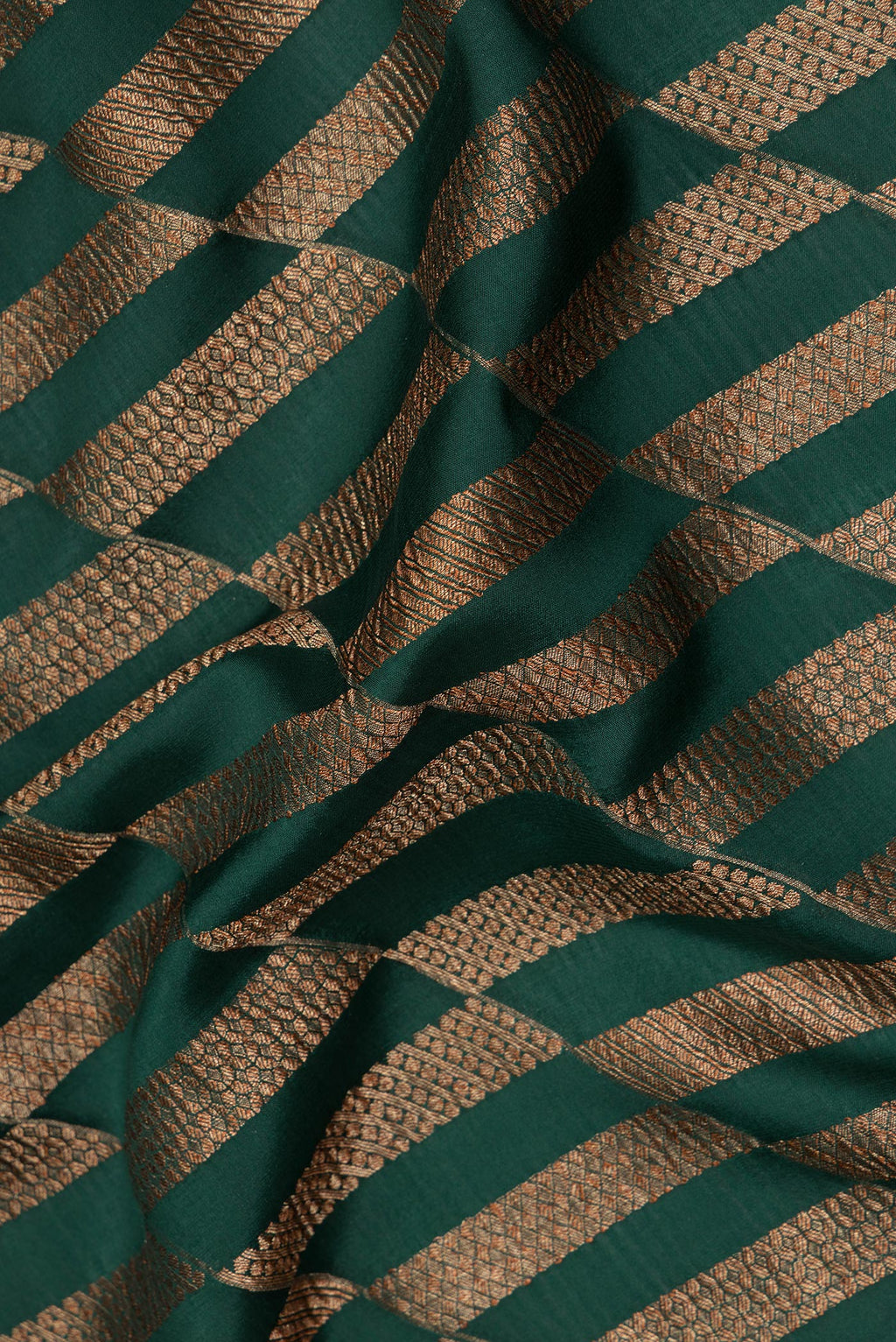 Close up of Pure Silk Bottle Green Dual Tone Banarasi Georgette Saree with Zari Brocade on the body and Zari Border.  displaying folds