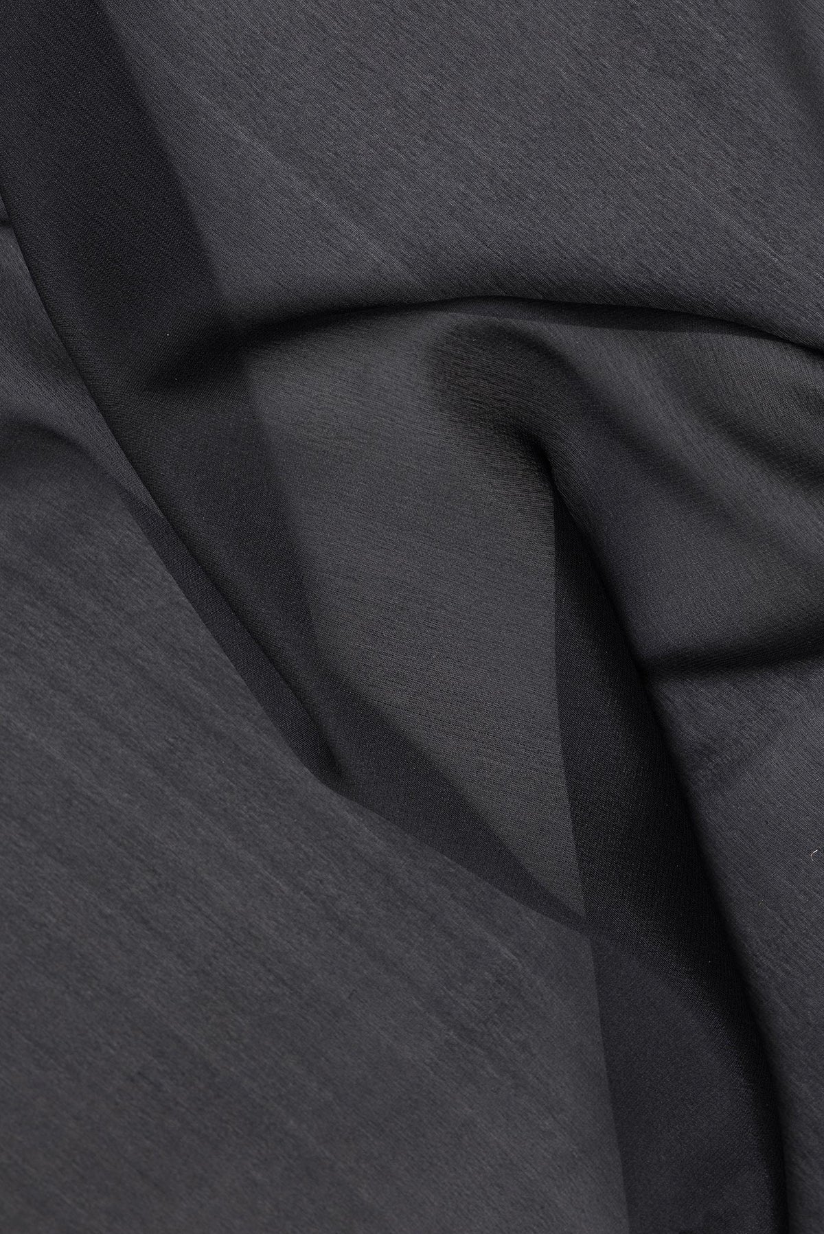 Close up of Black Banarasi Georgette Saree with Plain Body and Fancy Border.  displaying folds
