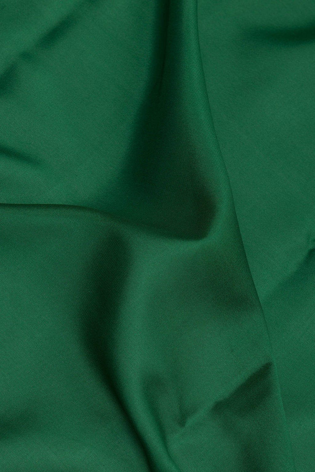 Close up of Green Georgette Saree with Plain Body and Fancy Border.  displaying folds