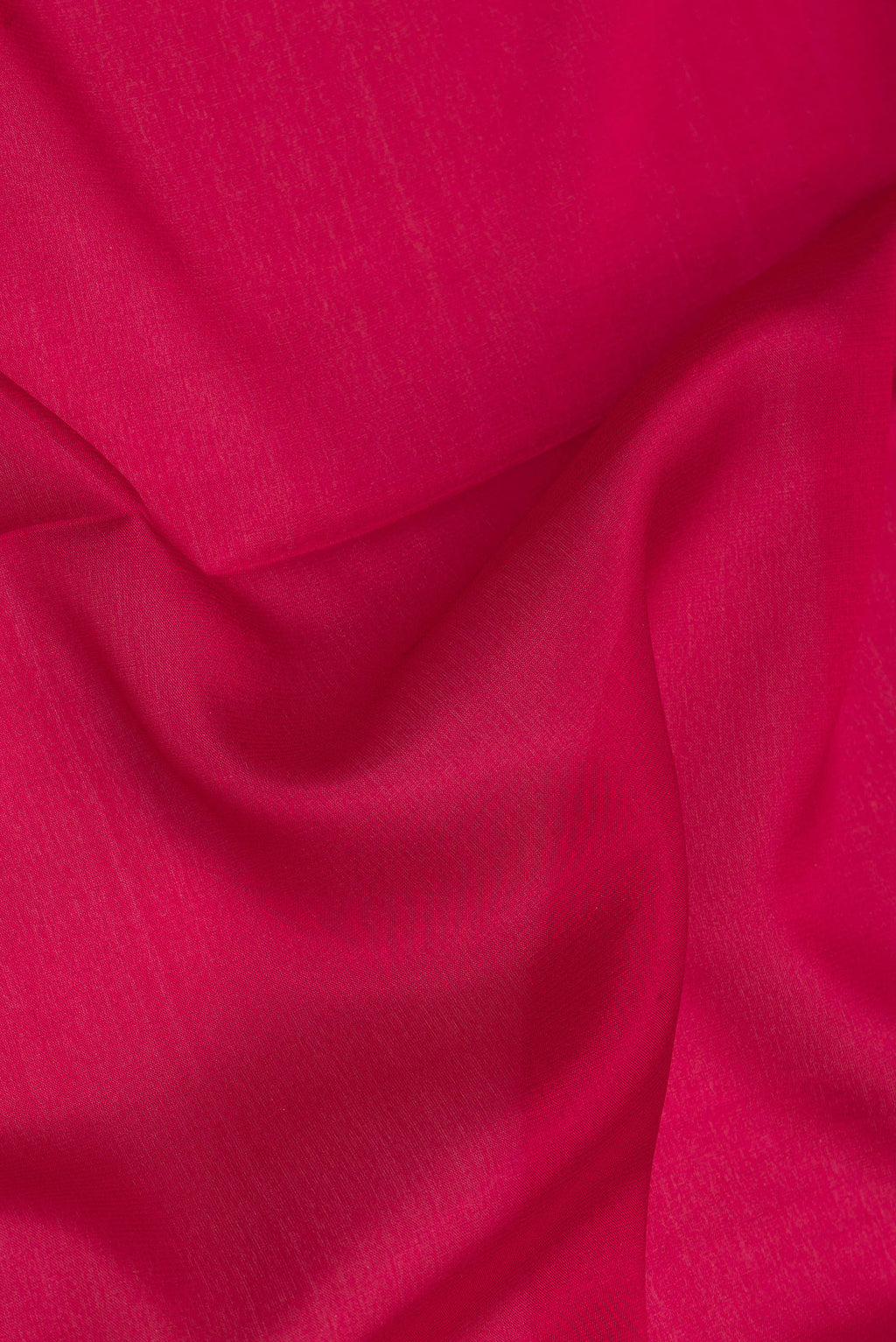 Close up of Dark Pink Georgette Saree with Plain Body and Fancy Border.  displaying folds