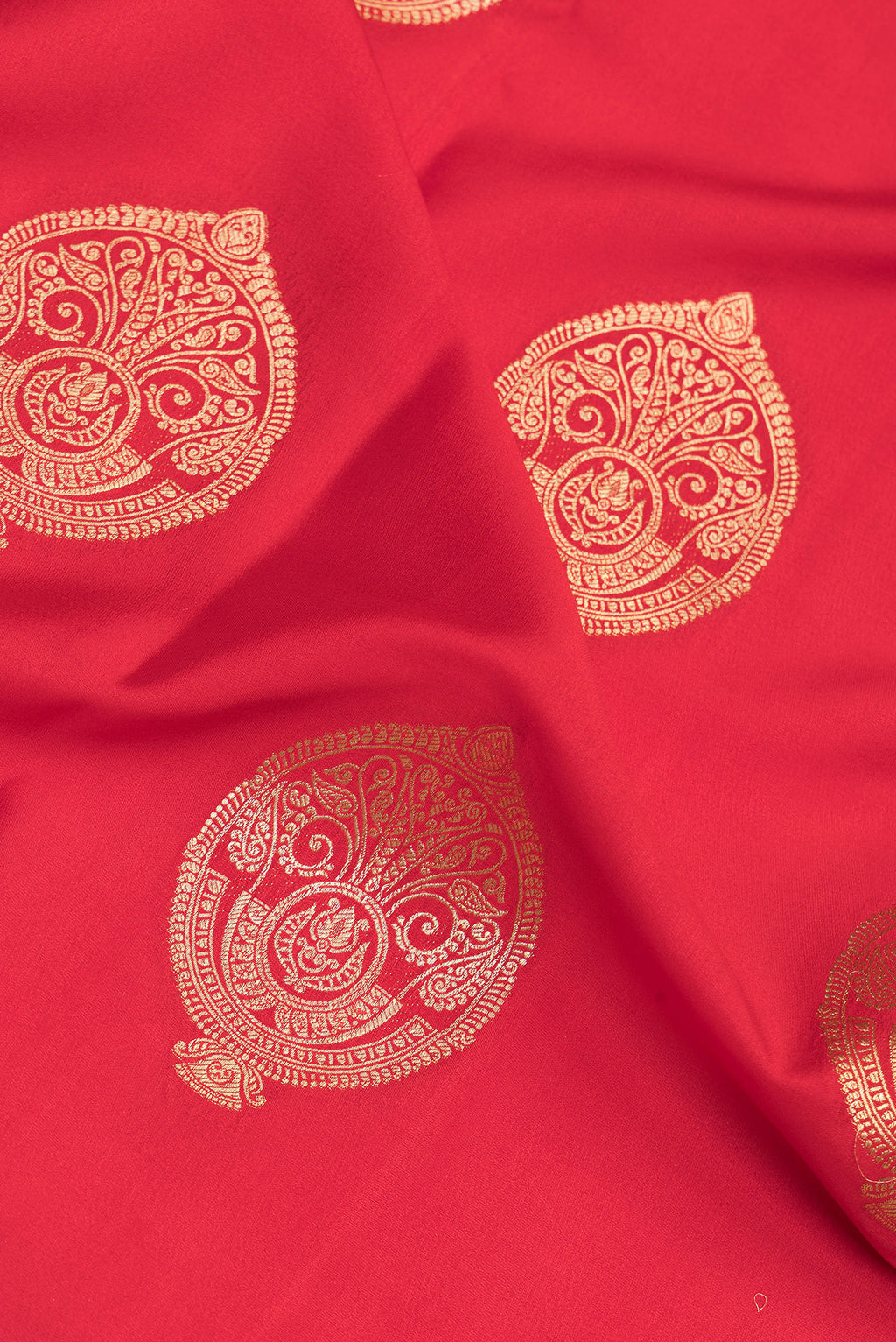 Close up of Pure Silk Red Dual Tone Banarasi Georgette Saree with Zari Butta on the body and Zari Border.  displaying folds