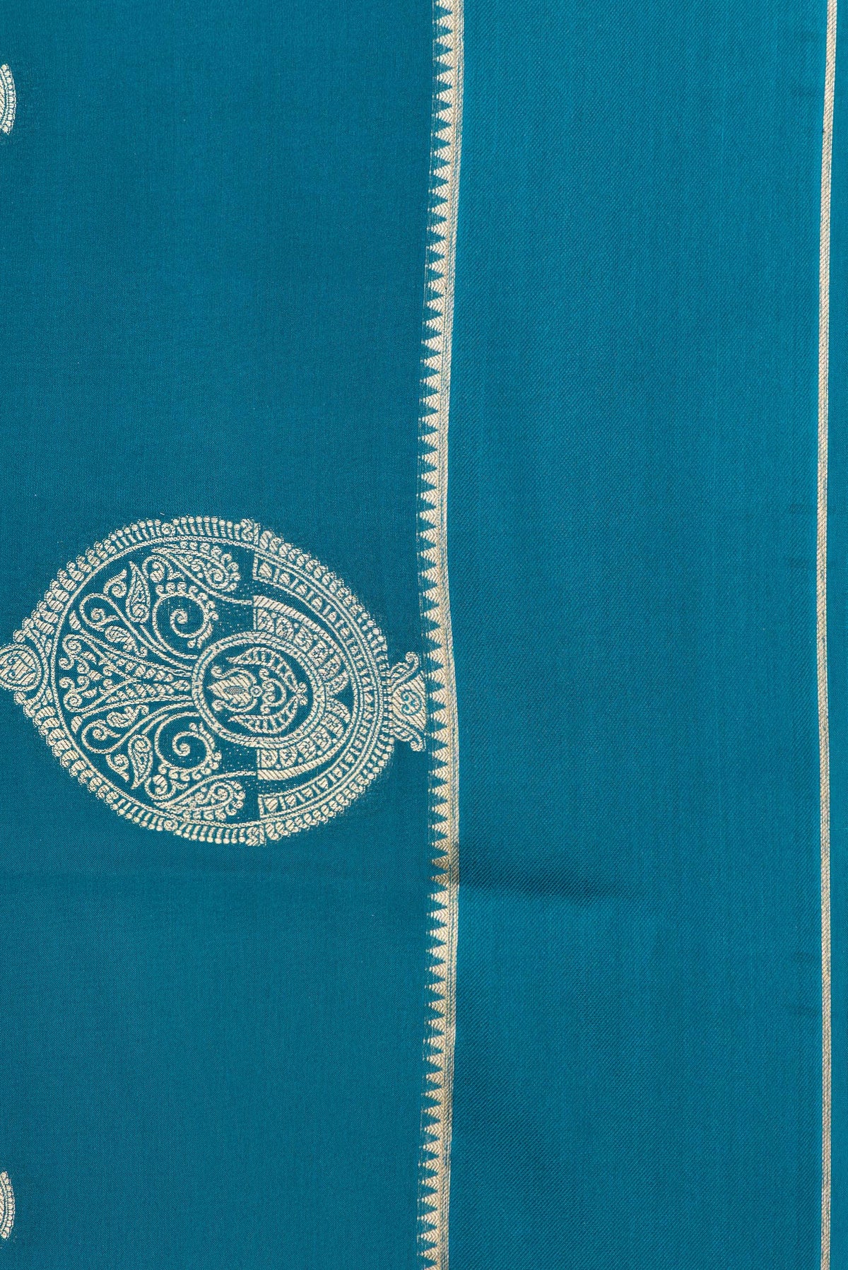 Border image of Pure Silk Peacock Blue Dual Tone Banarasi Georgette Saree with Zari Butta on the body and Zari Border. 