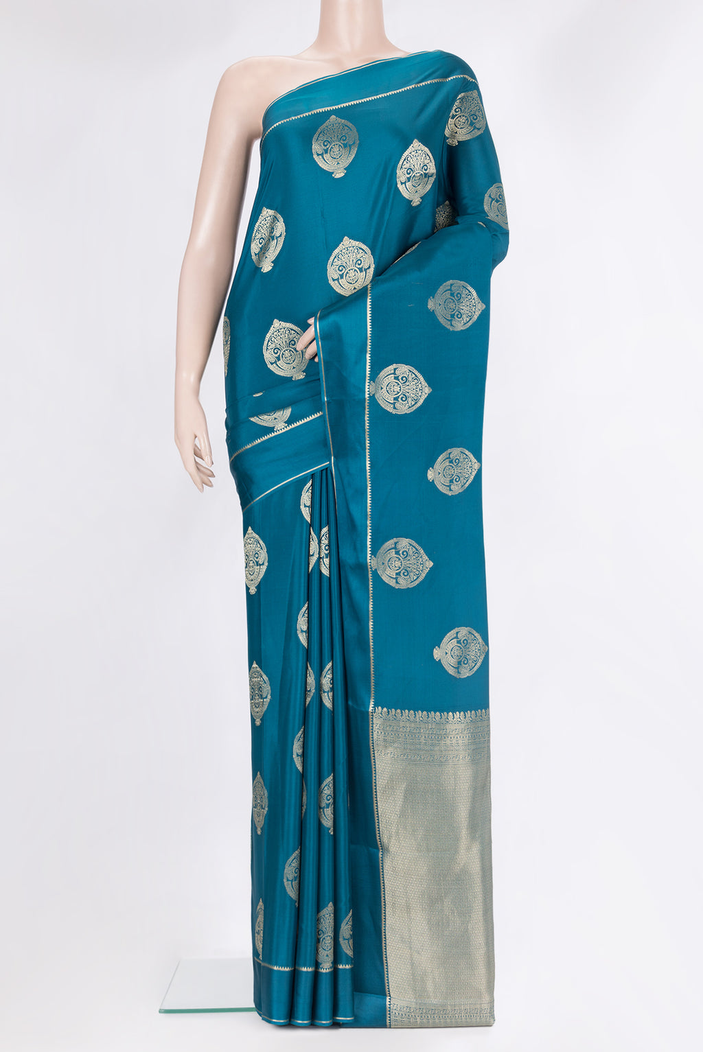 Pure Silk Peacock Blue Dual Tone Banarasi Georgette Saree with Zari Butta on the body and Zari Border.  displayed on a mannequin
