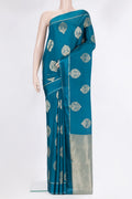 Pure Silk Peacock Blue Dual Tone Banarasi Georgette Saree with Zari Butta on the body and Zari Border.  displayed on a mannequin