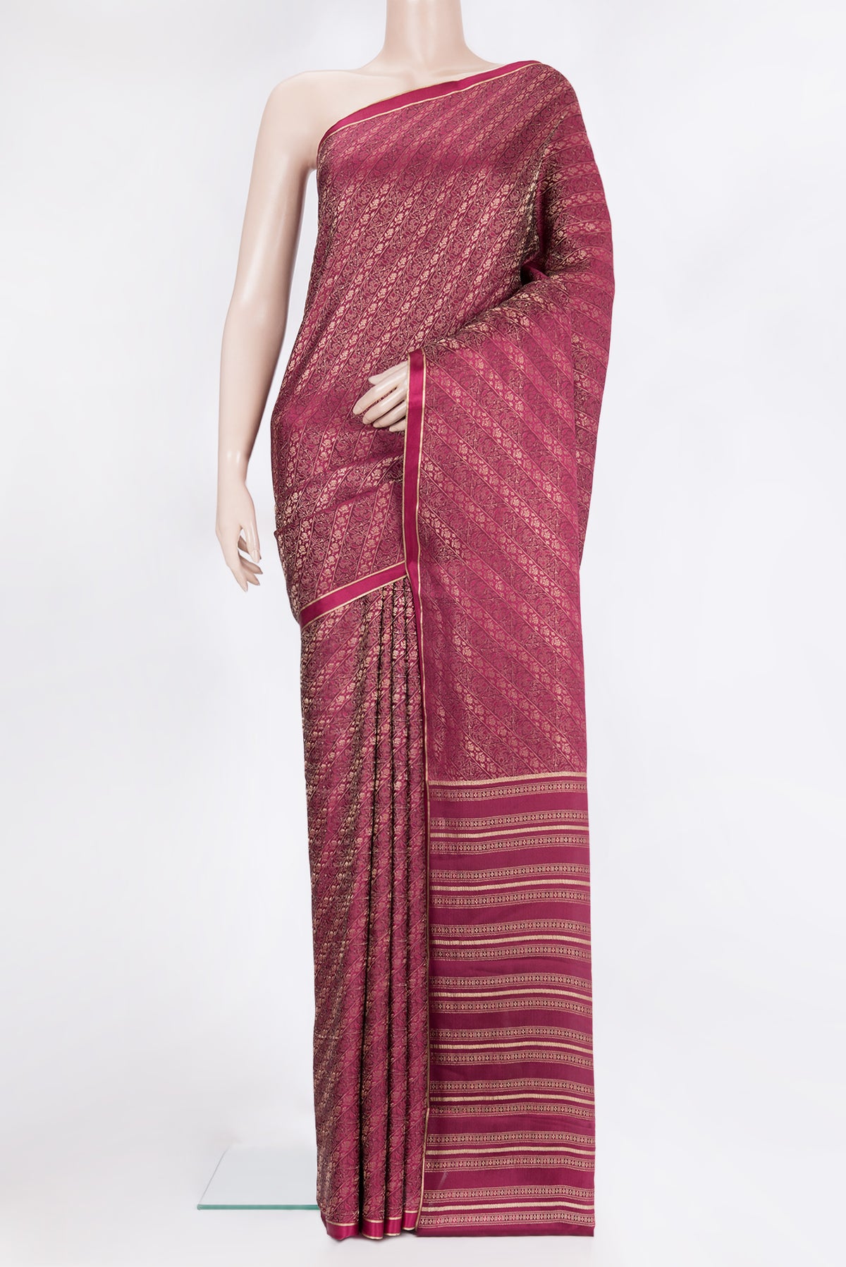 Magenta Georgette Saree with Zari Brocade on the body and Zari Border.  displayed on a mannequin